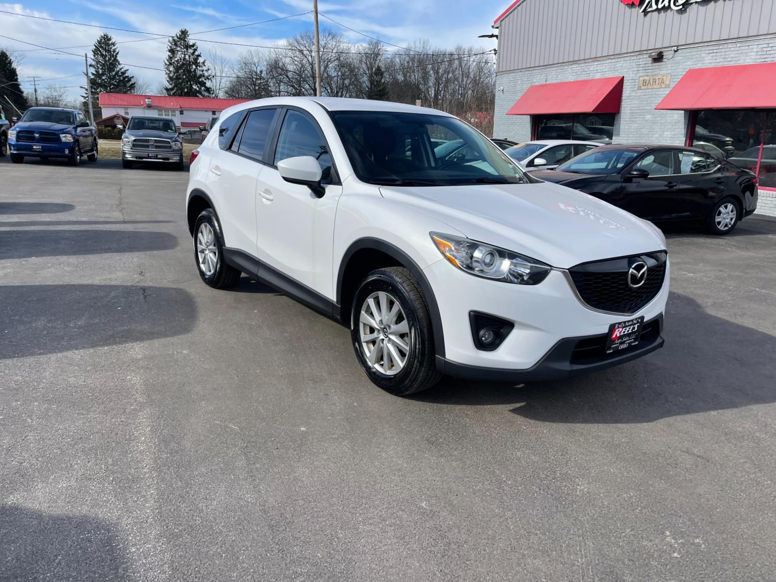 2015 White /Black Mazda CX-5 Touring AWD (JM3KE4CYXF0) with an 2.5L I4 DOHC 16V engine, 6-Speed Automatic transmission, located at 547 E. Main St., Orwell, OH, 44076, (440) 437-5893, 41.535435, -80.847855 - This 2015 Mazda CX-5 Touring AWD is a well-equipped SUV that offers a blend of performance, safety, and convenience for its drivers. Being a one-owner vehicle as per its Carfax report signifies well-attended maintenance and care. It is loaded with advanced features such as Blind Spot Monitoring and - Photo #2